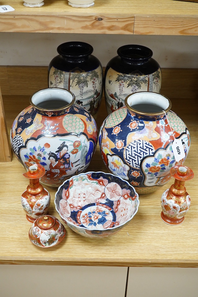 Japanese Kutani, Satsuma and Imari; four vases, a bowl, a pair of candlesticks and a pot (8). Condition - candle sticks damaged